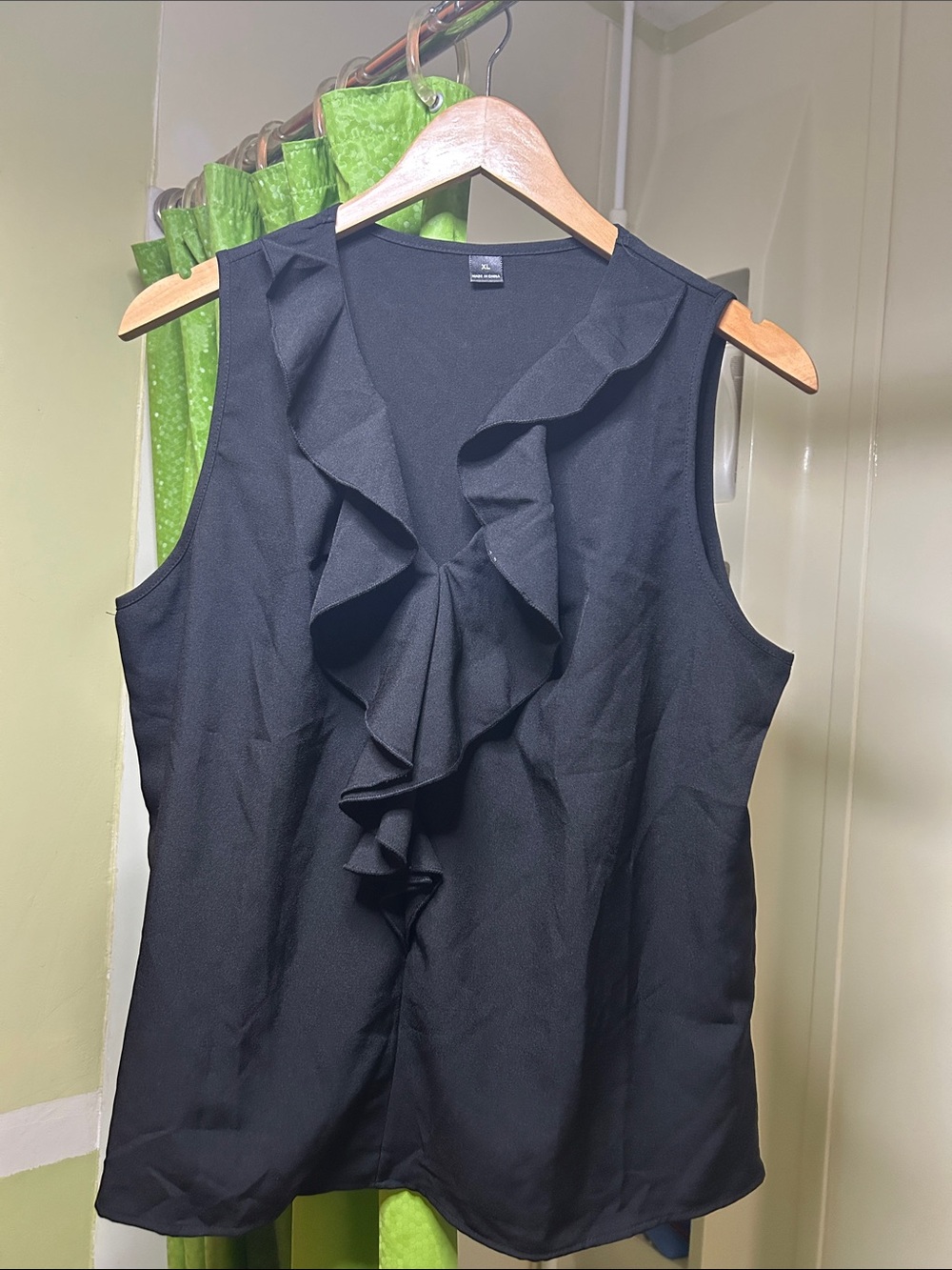 Black Ruffle Front Sleeveless Blouse
